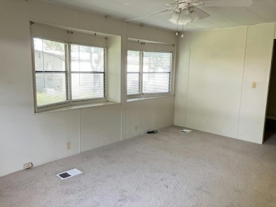 Spacious 2-bed, 2-bath home located just steps from the pool and on Fairways Country Club in Florida - for sale on GolfHomes.com, golf home, golf lot