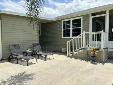 Like-new 2-bedroom, 2-bathroom home in a peaceful 55+ community on Fairways Country Club in Florida - for sale on GolfHomes.com, golf home, golf lot