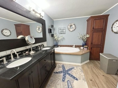 Like-new 2-bedroom, 2-bathroom home in a peaceful 55+ community on Fairways Country Club in Florida - for sale on GolfHomes.com, golf home, golf lot