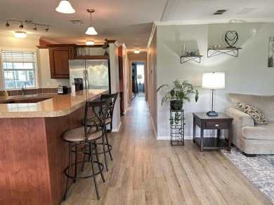 Like-new 2-bedroom, 2-bathroom home in a peaceful 55+ community on Fairways Country Club in Florida - for sale on GolfHomes.com, golf home, golf lot