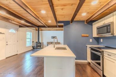 Tucked away in the serene heart of the Lake Wallenpaupack region on Paupack Hills Golf and Country Club in Pennsylvania - for sale on GolfHomes.com, golf home, golf lot