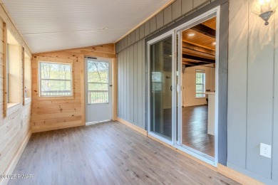 Tucked away in the serene heart of the Lake Wallenpaupack region on Paupack Hills Golf and Country Club in Pennsylvania - for sale on GolfHomes.com, golf home, golf lot