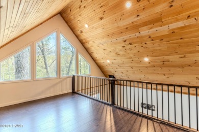 Tucked away in the serene heart of the Lake Wallenpaupack region on Paupack Hills Golf and Country Club in Pennsylvania - for sale on GolfHomes.com, golf home, golf lot