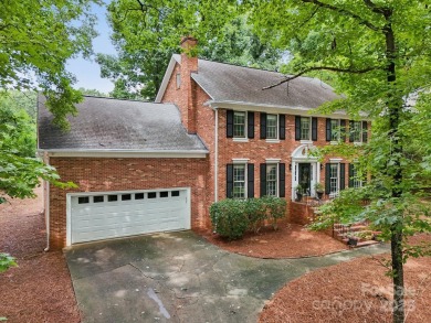 Full-brick, two-story home located on the 13th hole of one of on Raintree Country Club in North Carolina - for sale on GolfHomes.com, golf home, golf lot