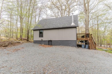 Tucked away in the serene heart of the Lake Wallenpaupack region on Paupack Hills Golf and Country Club in Pennsylvania - for sale on GolfHomes.com, golf home, golf lot