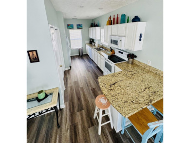 This spacious 4 LARGE Bedroom 4 Bath raised beach house is just on Prestwick Country Club in South Carolina - for sale on GolfHomes.com, golf home, golf lot