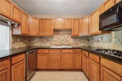 This charming Mid-Century home in Lithonia's Saddlewood on Mystery Valley Golf Course in Georgia - for sale on GolfHomes.com, golf home, golf lot