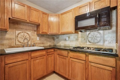 This charming Mid-Century home in Lithonia's Saddlewood on Mystery Valley Golf Course in Georgia - for sale on GolfHomes.com, golf home, golf lot