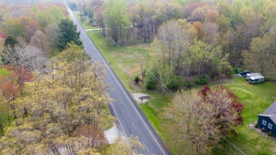 WOODED ONE ACRE Building Site offers an attractive canvas for on Whittaker Woods Golf Course in Michigan - for sale on GolfHomes.com, golf home, golf lot