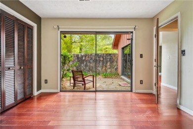 This charming Mid-Century home in Lithonia's Saddlewood on Mystery Valley Golf Course in Georgia - for sale on GolfHomes.com, golf home, golf lot