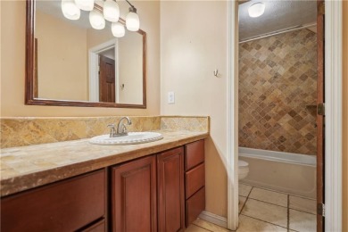 This charming Mid-Century home in Lithonia's Saddlewood on Mystery Valley Golf Course in Georgia - for sale on GolfHomes.com, golf home, golf lot