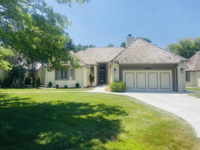 This beautiful patio home is in a gated community with a back on Tallgrass Country Club in Kansas - for sale on GolfHomes.com, golf home, golf lot