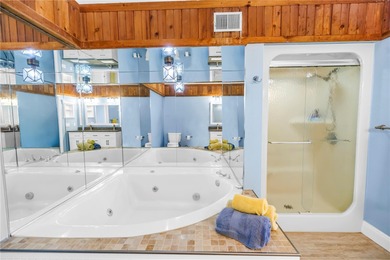 Welcome to coastal living in Treasure Island, a true Norman on Treasure Bay Golf and Tennis in Florida - for sale on GolfHomes.com, golf home, golf lot