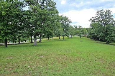 Sitting on 1.55 pristine, park-like acres within walking on Holiday Island Executive Golf Course in Arkansas - for sale on GolfHomes.com, golf home, golf lot