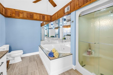 Welcome to coastal living in Treasure Island, a true Norman on Treasure Bay Golf and Tennis in Florida - for sale on GolfHomes.com, golf home, golf lot