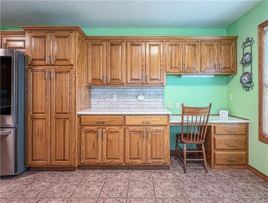 Sitting on 1.55 pristine, park-like acres within walking on Holiday Island Executive Golf Course in Arkansas - for sale on GolfHomes.com, golf home, golf lot