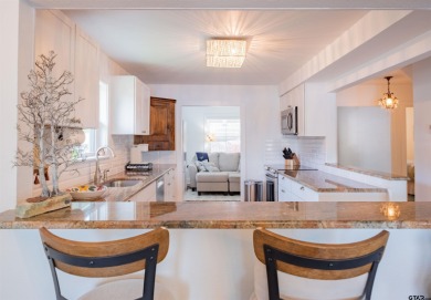 **Lakefront Charm Meets Updated Comfort in Hideaway Lake** on Hide-A-Way Lake Golf Course in Texas - for sale on GolfHomes.com, golf home, golf lot