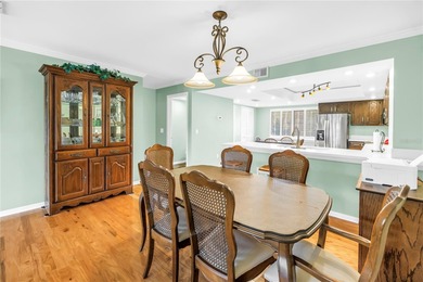 Welcome to coastal living in Treasure Island, a true Norman on Treasure Bay Golf and Tennis in Florida - for sale on GolfHomes.com, golf home, golf lot