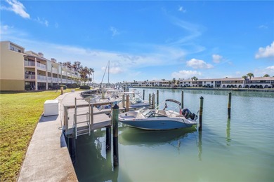 Welcome to coastal living in Treasure Island, a true Norman on Treasure Bay Golf and Tennis in Florida - for sale on GolfHomes.com, golf home, golf lot