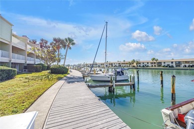 Welcome to coastal living in Treasure Island, a true Norman on Treasure Bay Golf and Tennis in Florida - for sale on GolfHomes.com, golf home, golf lot