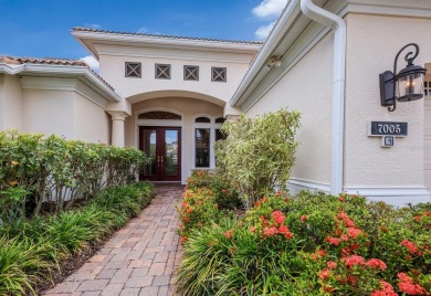 This gorgeous custom Lee Wetherington home is poised on one of on Lakewood Ranch Golf and Country Club in Florida - for sale on GolfHomes.com, golf home, golf lot