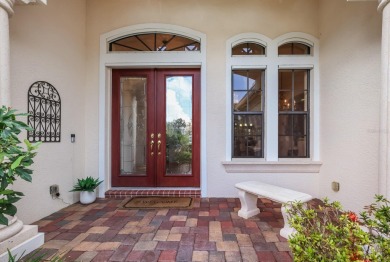 This gorgeous custom Lee Wetherington home is poised on one of on Lakewood Ranch Golf and Country Club in Florida - for sale on GolfHomes.com, golf home, golf lot