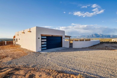 Discover the perfect blend of modern luxury and Southwest charm on Taos Country Club in New Mexico - for sale on GolfHomes.com, golf home, golf lot