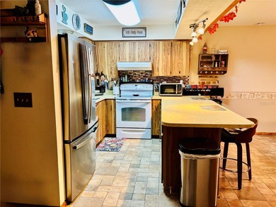 Charming 3 Bedroom 2 Bathroom Home in the *W* Section of Palm on The Grand Club - Pine Lakes Course in Florida - for sale on GolfHomes.com, golf home, golf lot