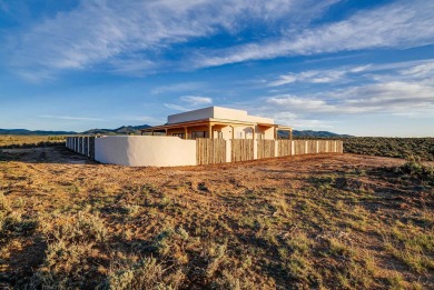Discover the perfect blend of modern luxury and Southwest charm on Taos Country Club in New Mexico - for sale on GolfHomes.com, golf home, golf lot