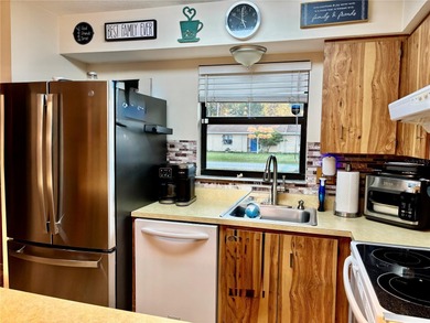 Charming 3 Bedroom 2 Bathroom Home in the *W* Section of Palm on The Grand Club - Pine Lakes Course in Florida - for sale on GolfHomes.com, golf home, golf lot