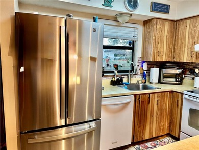 Charming 3 Bedroom 2 Bathroom Home in the *W* Section of Palm on The Grand Club - Pine Lakes Course in Florida - for sale on GolfHomes.com, golf home, golf lot