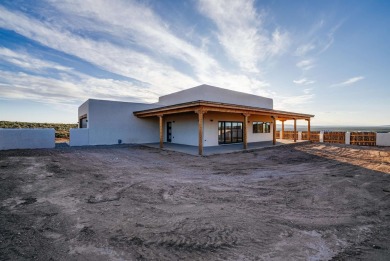 Discover the perfect blend of modern luxury and Southwest charm on Taos Country Club in New Mexico - for sale on GolfHomes.com, golf home, golf lot
