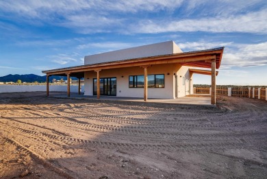 Discover the perfect blend of modern luxury and Southwest charm on Taos Country Club in New Mexico - for sale on GolfHomes.com, golf home, golf lot