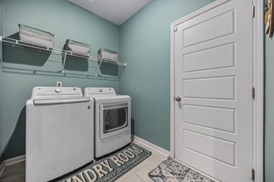 Welcome home to this stunning 3-bedroom, 2-bath lakefront home on Pine Lakes Country Club in South Carolina - for sale on GolfHomes.com, golf home, golf lot