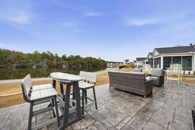 Welcome home to this stunning 3-bedroom, 2-bath lakefront home on Pine Lakes Country Club in South Carolina - for sale on GolfHomes.com, golf home, golf lot