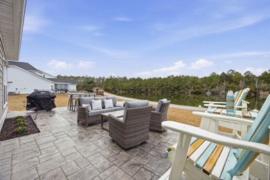 Welcome home to this stunning 3-bedroom, 2-bath lakefront home on Pine Lakes Country Club in South Carolina - for sale on GolfHomes.com, golf home, golf lot