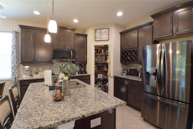 Move-in Ready 3 Bedroom, 2 Bath Home with Serene Pond Views! on Tampa Bay Golf and Country Club in Florida - for sale on GolfHomes.com, golf home, golf lot
