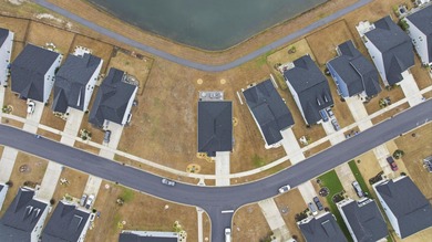 Welcome home to this stunning 3-bedroom, 2-bath lakefront home on Pine Lakes Country Club in South Carolina - for sale on GolfHomes.com, golf home, golf lot