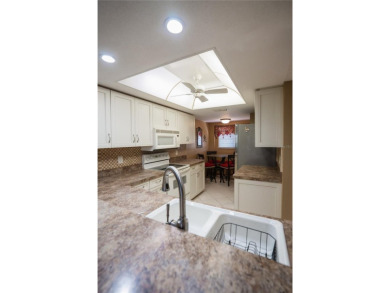 Top-Floor Condo with Golf Course Views, Elevator Access on Tarpon Springs Golf Course in Florida - for sale on GolfHomes.com, golf home, golf lot