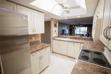 Top-Floor Condo with Golf Course Views, Elevator Access on Tarpon Springs Golf Course in Florida - for sale on GolfHomes.com, golf home, golf lot