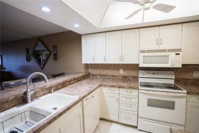 Top-Floor Condo with Golf Course Views, Elevator Access on Tarpon Springs Golf Course in Florida - for sale on GolfHomes.com, golf home, golf lot
