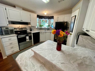 Located on a quiet street with a view of the Golf Course and on Water Oak Country Club Estates in Florida - for sale on GolfHomes.com, golf home, golf lot