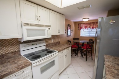 Top-Floor Condo with Golf Course Views, Elevator Access on Tarpon Springs Golf Course in Florida - for sale on GolfHomes.com, golf home, golf lot