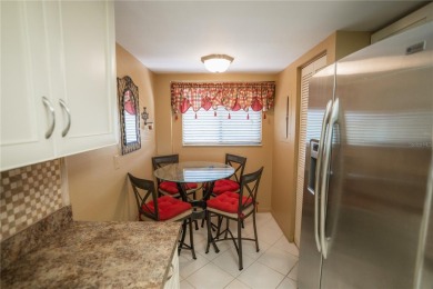 Top-Floor Condo with Golf Course Views, Elevator Access on Tarpon Springs Golf Course in Florida - for sale on GolfHomes.com, golf home, golf lot