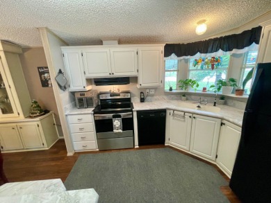 Located on a quiet street with a view of the Golf Course and on Water Oak Country Club Estates in Florida - for sale on GolfHomes.com, golf home, golf lot