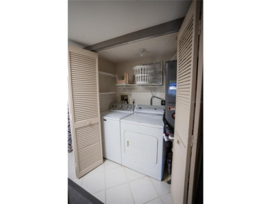 Top-Floor Condo with Golf Course Views, Elevator Access on Tarpon Springs Golf Course in Florida - for sale on GolfHomes.com, golf home, golf lot