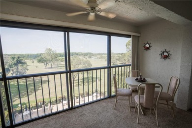 Top-Floor Condo with Golf Course Views, Elevator Access on Tarpon Springs Golf Course in Florida - for sale on GolfHomes.com, golf home, golf lot