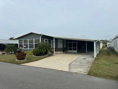 This Modern Treasure is a Beautiful Oasis!    This home is in on Lake Henry Golf Club in Florida - for sale on GolfHomes.com, golf home, golf lot