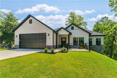 Welcome to this lovely 2-year-old home nestled in a quiet on Bella Vista Country Club - Highlands in Arkansas - for sale on GolfHomes.com, golf home, golf lot