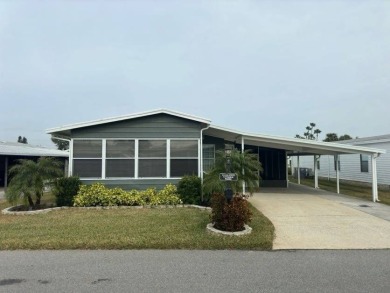 This Modern Treasure is a Beautiful Oasis!    This home is in on Lake Henry Golf Club in Florida - for sale on GolfHomes.com, golf home, golf lot